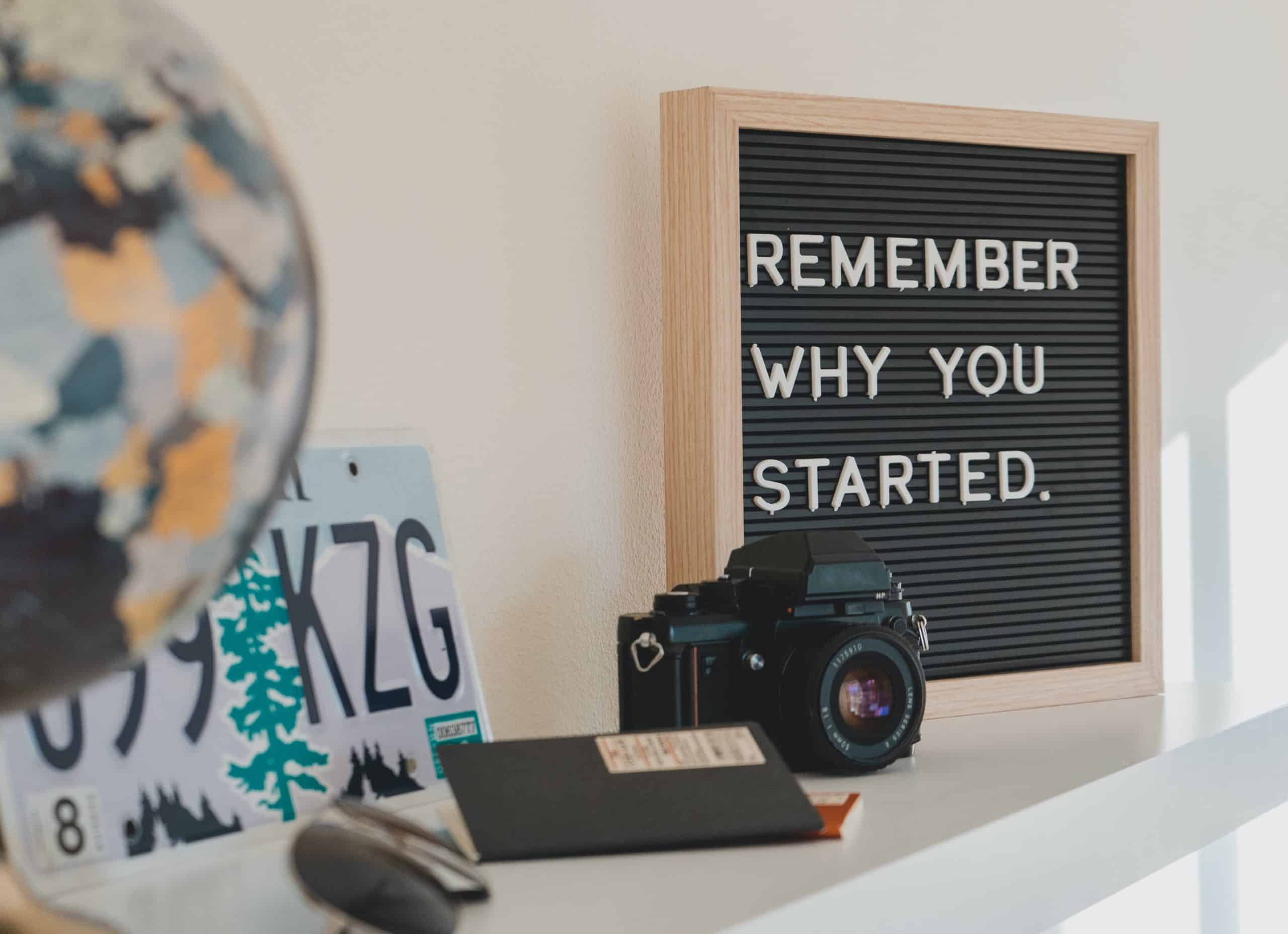Remember Why You Started Sign Sitting on Shelf
